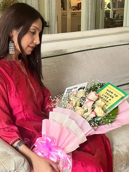 Holding a beautiful book bouquet. I look forward to reading these and sharing my reviews. While I enjoy classic legal movies, books remain my first love and a constant source of learning and reflection.