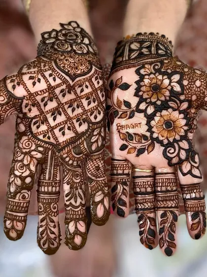 This design shows two different styles. One hand has a traditional grid pattern, while the other features a bold floral design with the client's name.