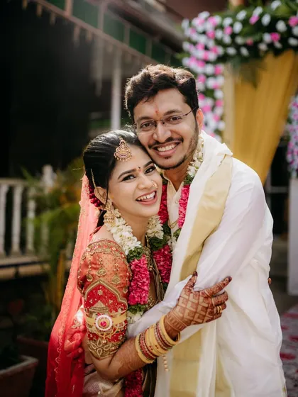 This is the 'janti sambandha' I speak of, a joyful union. The pure, unscripted happiness in this hug, with the bride and groom beaming, is what makes wedding photography so special. It’s about capturing the real, heartfelt connections.