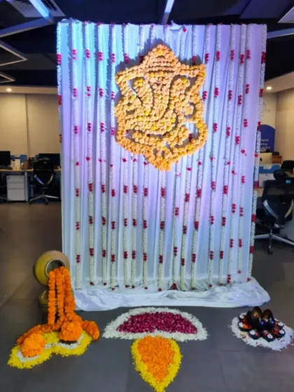 For Diwali and Ganesh Chaturthi celebrations in offices or homes, I create traditional backdrops using marigold flowers. Here, I designed a Ganesha motif entirely out of fresh flowers against a curtain of floral strings.