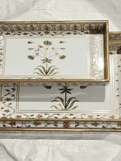 Exquisite serving trays with intricate floral designs, another example of the unique home decor items available.