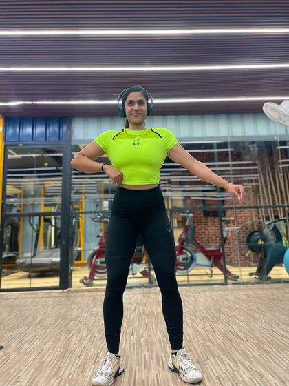 A front pose in the gym, feeling energized and ready to tackle the week's workouts.