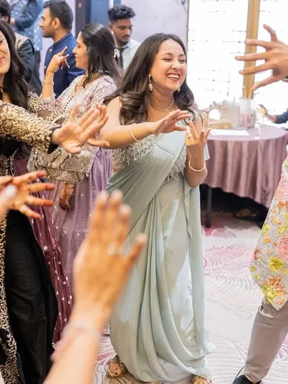 Leading the guests in a group dance. It's not about perfect steps; it's about having fun together.