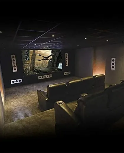 This theater demonstrates the power of an integrated KEF THX certified in-wall speaker system. The speakers are flush-mounted into the walls, providing a clean, unobtrusive look while delivering the powerful, detailed surround sound required for an authentic cinematic experience. The tiered leather seating completes the professional setup.