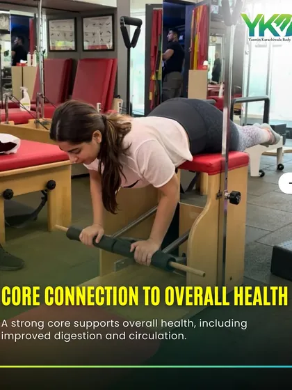 A strong core supports your overall health. Here, a client uses the Pilates chair, an advanced piece of equipment excellent for building deep core connection and stability.