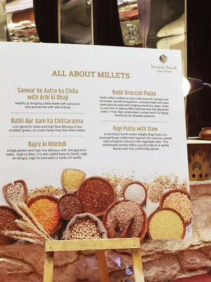 All About Millets. We design menus that are both delicious and nutritious, as showcased by this informative sign for our healthy millet-based dishes.
