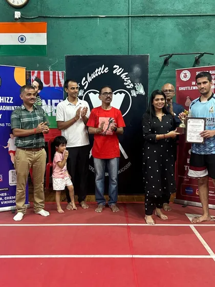 A player receives his award at the in-house tournament, a culmination of his hard work and dedication during training.