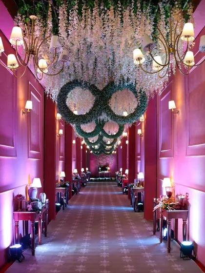 Your wedding is a journey, and we design every step of it. This grand, illuminated walkway for our 'Anant' themed wedding created a dramatic and enchanting entrance, building anticipation for the ceremony ahead.