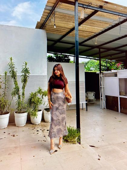 A full-length shot of the crop top and satin skirt combo, perfect for a brunch or a day out in the city.