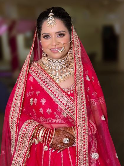 My bride Divya, looking radiant and happy. We went for a classic look with soft smokey eyes and a nude pink lip that complemented her heavy jewelry perfectly.