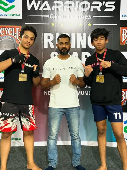 Two of our rising stars with their gold medals and their coach. This is what happens when young talent meets expert guidance and a lot of hard work.
