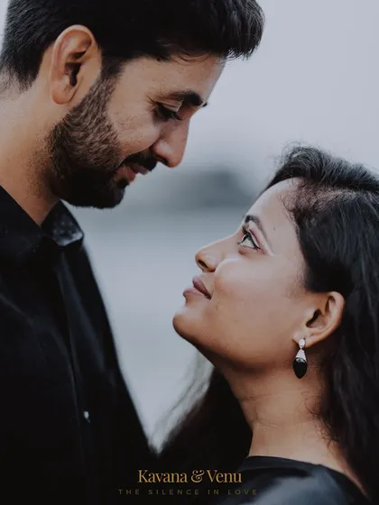 An intimate close-up portrait that focuses on the silent conversation between a couple, highlighting the emotion in their eyes.