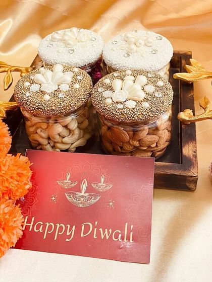 Another view of the decorative dry fruit jars, highlighting the detailed craftsmanship on the lids.