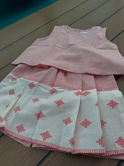I love designing clothes with little secrets. This looks like a cute pleated skirt set, but it’s actually a pair of skorts underneath! It gives your little girl the freedom to play, climb, and tumble without any worries. It’s all about that fuss-free comfort.
