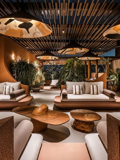 A perspective from between two seating areas, showing the depth and scale of the terrace design. Even in a large space, we create distinct, intimate zones that feel connected.