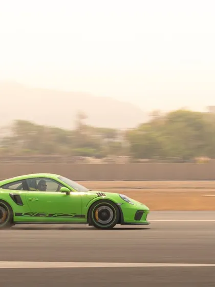 I specialize in capturing the essence of speed, as seen with this Porsche GT3 RS in a full-speed panning shot that blurs the background to emphasize its motion.