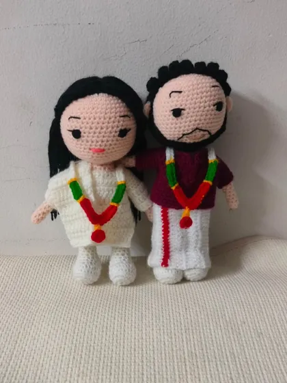 This is a South Indian wedding couple I made. The groom is in a traditional veshti and the bride is in a white saree with a beautiful garland. I love making dolls in different traditional dresses.