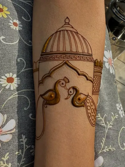 The peacock and dome outline is complete. The clean lines are now ready for intricate shading and filling.