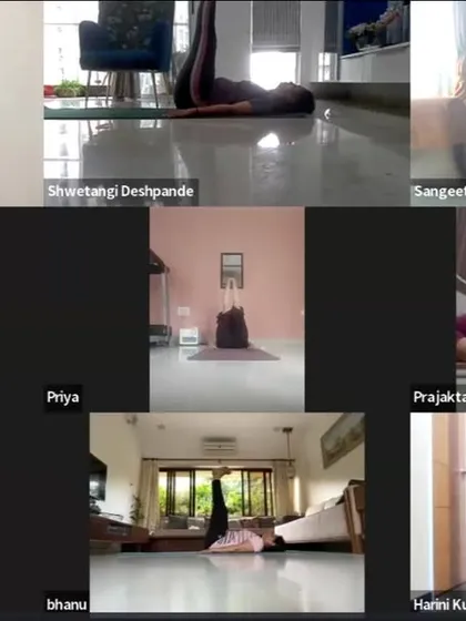 A gallery view of participants practicing Urdhva Prasarita Padasana (Upward Extended Feet Pose). This asana is excellent for strengthening the core and improving circulation in the legs.