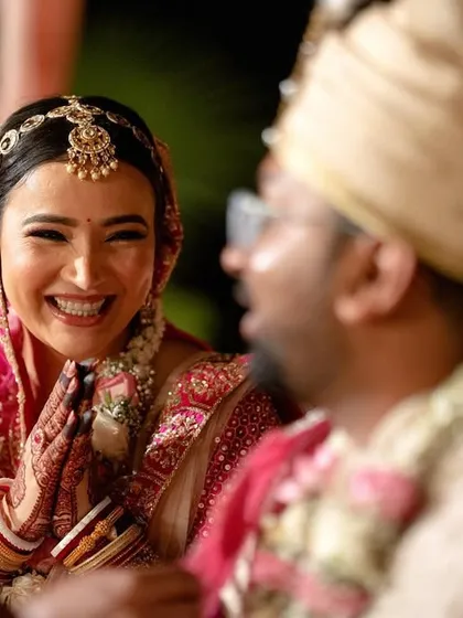 The bride's infectious laughter as she shares a joke with the groom during the ceremony.