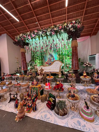 A traditional baby shower (Seemantham) with a touch of grandeur. We created a beautiful stage with a Lord Krishna backdrop, hanging floral strings, and an elaborate display of traditional offerings, making it a truly divine and memorable celebration for the family.