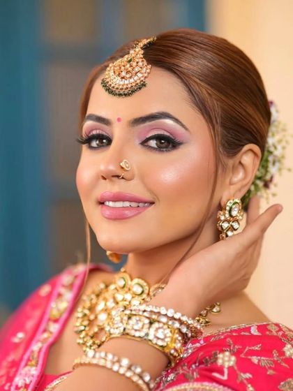 A beautiful close-up highlighting the details of a Kundan maang tikka, jhumkas, and choker. This image shows the quality and craftsmanship you can expect from our rental jewellery.