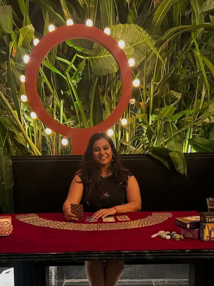 Here I am, set up for a wonderful Family Day event for Accel. It brings me so much joy to bring tarot to corporate gatherings, creating a unique space for insight and connection. My setup includes my cards, crystals, and a little statue of Mother Earth to keep us grounded.