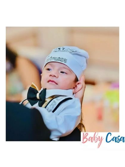 A tiny gentleman ready for his first formal event. This newborn tuxedo romper with a personalized cap is perfect for a naming ceremony or bringing your baby home in style.