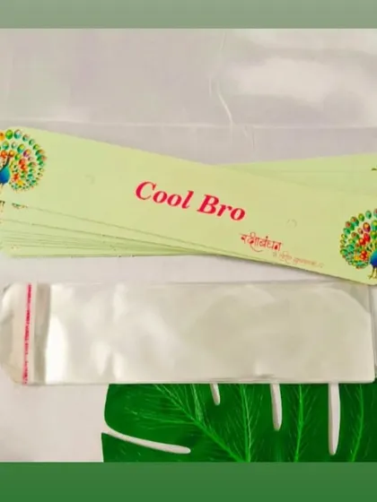 Complete your handmade Rakhis with our specially designed packing cards. This "Cool Bro" card with a peacock design comes with a clear pouch for professional-looking packaging.