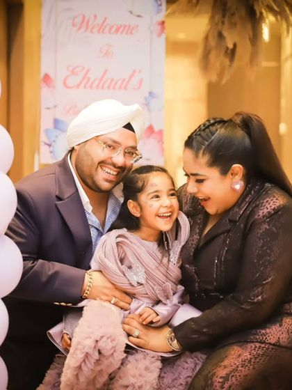 A candid family photo filled with genuine smiles and laughter. We believe these unposed moments are the ones you'll cherish most.