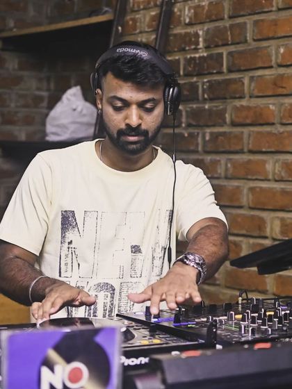 Another angle of me mixing at Sherlock's, with the brick wall background adding to the pub's rustic vibe.