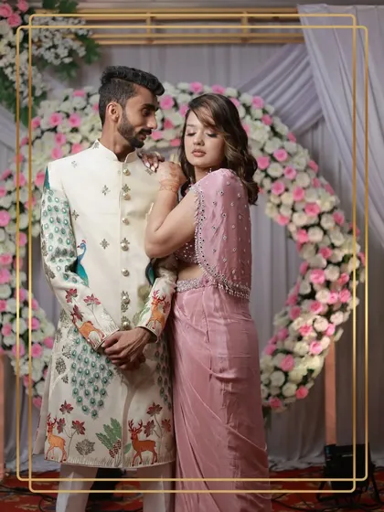 For the groom who wants something truly unique. This client looks incredible in our off-white sherwani featuring a modern peacock and deer motif, proving that traditional wear can be a canvas for artistry.