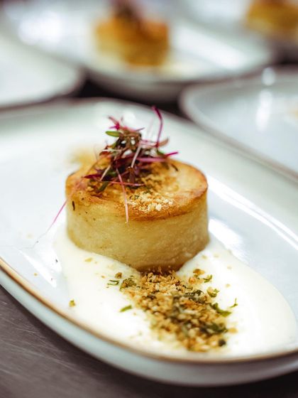 A beautifully presented potato fondant, a gourmet dish created for one of our curated dining experiences.
