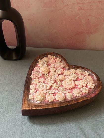 Another angle of the heart dough bowl candle, showing the intricate detail of the hand-placed wax flowers. Each one is a little different, making your candle truly unique.