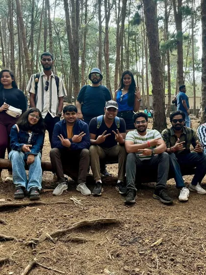 Taking a break in the famous pine forests of Kodaikanal. These moments of rest and conversation are what make group travel special.