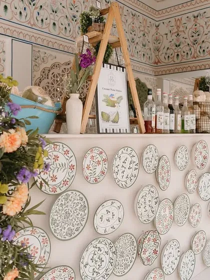 A unique bar counter decorated with intricate ceramic plates. This artistic detail added a touch of uniqueness and craftsmanship to the Mehendi ceremony.