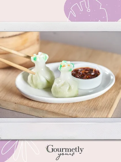 We believe that even the smallest bite should be a work of art. These delicate money bag dim sums, served with a flavorful dipping sauce, exemplify our attention to detail and our passion for creating exquisite, bite-sized appetizers for any occasion.
