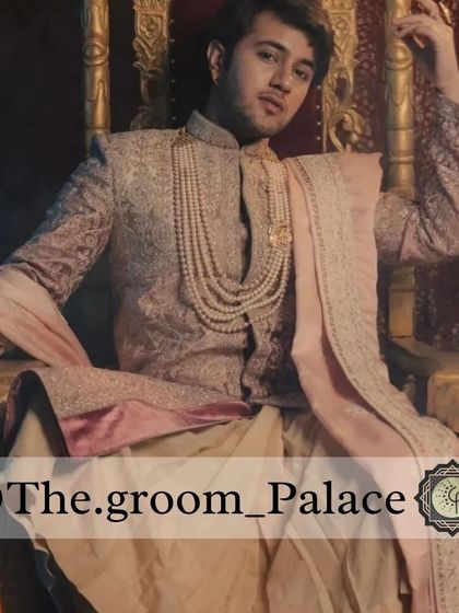 Seated on a throne, this model showcases the grandeur of our legacy collection sherwani. The rich fabric and detailed craftsmanship are evident in this powerful shot.