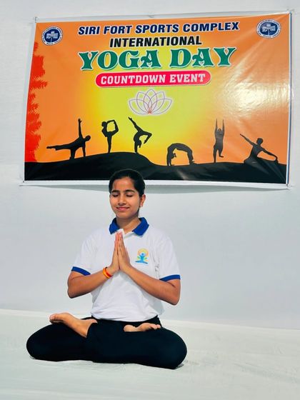 A moment of calm in Padmasana (Lotus Pose) before the start of the Yoga Day event. Centering myself allows me to better connect with and lead the participants.