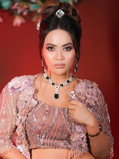 Another angle of this stunning party look. The makeup is glamorous yet sophisticated, perfect for any special occasion.