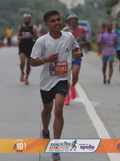 A happy face from the Bengaluru 10K Challenge. This runner's smile shows the joy and satisfaction of pushing your limits and completing the race.