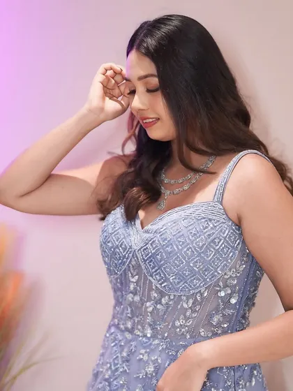 A dreamy look for a modern bride. The soft lavender tones of the makeup perfectly complement her gown, creating an ethereal and romantic vibe for her cocktail or reception event.