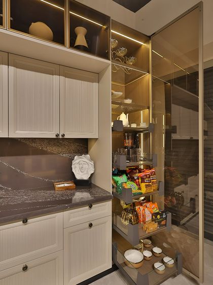 Here, the tall pantry unit with a pull-out system is on full display. This is a great example of how I integrate smart storage to make a kitchen highly functional without sacrificing style.