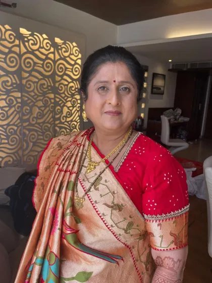 A portrait of the groom's mom, looking elegant and happy. The makeup is timeless and perfectly suited for her traditional attire.