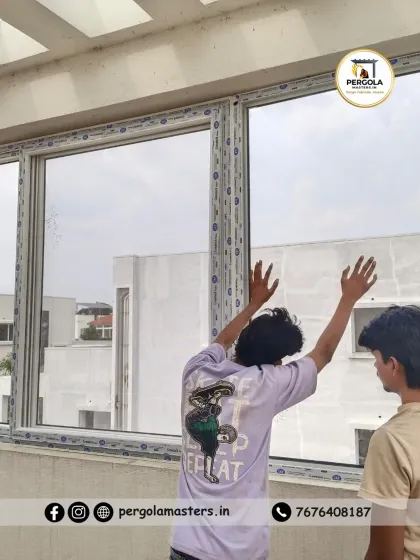Our installation team works together to carefully position a large glass panel into the UPVC frame. This step requires coordination and precision to ensure the glass is seated correctly for a perfect seal and smooth operation, especially for large fixed or sliding windows.