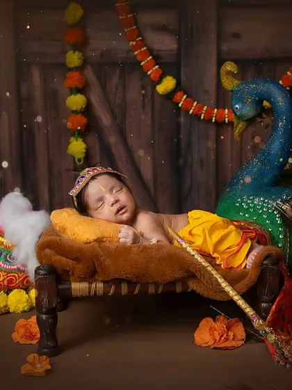 A sleepy little Kanha on his 'charpai'. The rustic, traditional setup provides a beautiful contrast to his delicate features.