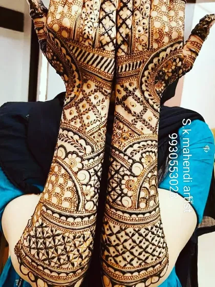 An extremely detailed and intricate design focused on fine line work. This full-coverage mehendi is perfect for brides who want a very rich and traditional look.