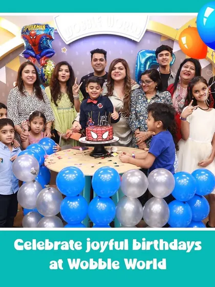 A full family photo capturing a joyful Spiderman-themed birthday celebration. We provide the perfect setting for your family's big moments.