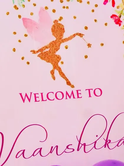 This close-up shows the detail on a welcome sign for Vaanshika's party. We use elegant fonts and glittery fairy graphics to add a touch of sparkle to our custom party stationery.