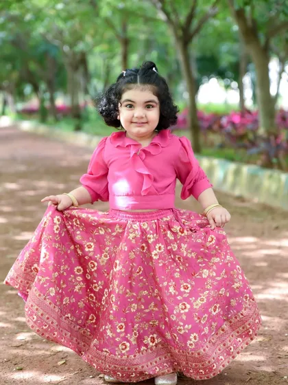 We love taking photos outdoors in namma Bengaluru's beautiful parks. The natural light and open space let your child's personality shine, just like this little one in her pretty pink dress.